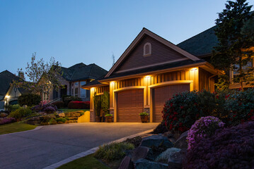 Garage door in luxury house with trees and nice landscape in Spring in Vancouver, Canada, North...