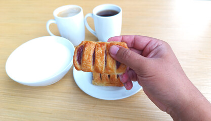 Holding delicious jam strawberry toast pie. tasty, menu, hot, closeup, high calories, arts, cake, mug, drink, objects, background, handle, beverage, cafe, coffee cup, closeup, freshness, healthy .