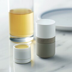Minimalist beverage presentation featuring complementary cylinders on marble surface