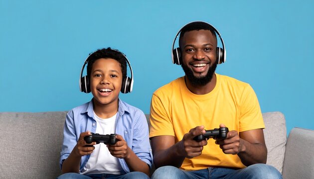 Father and Son Gaming Together with Game Controllers and Headphones on Blue Background
