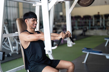 Young Man Engaging in Strength Training at Gym