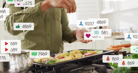 Woman seasoning vegetables at stove in kitchen, food marketing icons floating around cooking area - Powered by Adobe