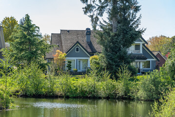 Luxury house with nice spring lake view and green landscape in Vancouver, Canada, North America. Day time on April 2025.