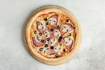 Ham, Mushroom & Olive Pizza – A classic pizza topped with juicy ham, sliced mushrooms, and black olives, set against a textured concrete background for a clean and modern aesthetic.