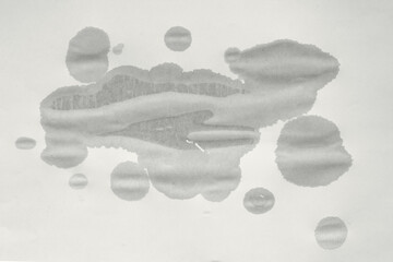 Blank wet sheet of paper. Wet spot on paper. Wet old paper