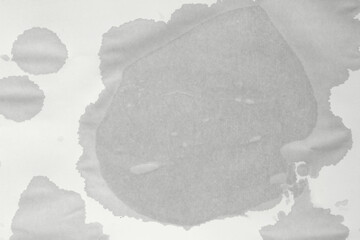 Wet spot on paper. Blank wet sheet of paper. Wet office paper