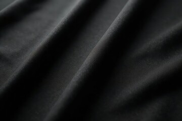 Close-up shot of a plain black shirt, soft fabric texture visible , simple, attire