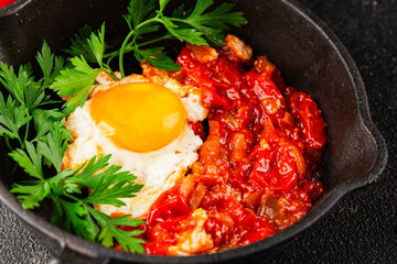Fried egg tomatoes shakshuka vegetable dish appetizer fresh delicious gourmet food background on the table rustic food top view copy space vegetarian  food