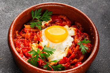 Fried egg tomatoes shakshuka vegetable dish appetizer fresh delicious gourmet food background on the table rustic food top view copy space vegetarian  food