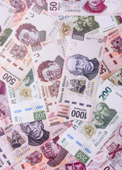 Money, Mexican currency, peso banknotes. Conceptual financial background