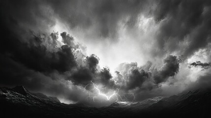 A dramatic black-and-white image of a stormy sky filled with dense, swirling clouds.