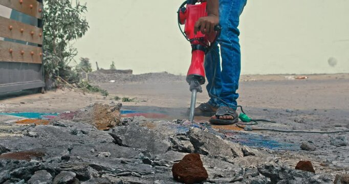 Heavy Duty Road Work &ndash; Breaking Pavement with a Drill