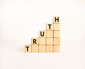Truth symbol. Concept word Truth on beautiful wooden blocks. Beautiful white table white...