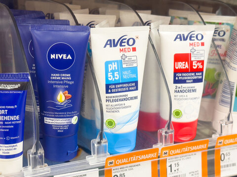 Various hand creams on shelf featuring nivea and aveo med for moisturizing and special skin needs