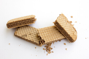Tasty chocolate wafer biscuits isolated on white background.