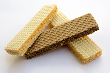 Tasty cheese and chocolated wafer biscuits isolated on white background.