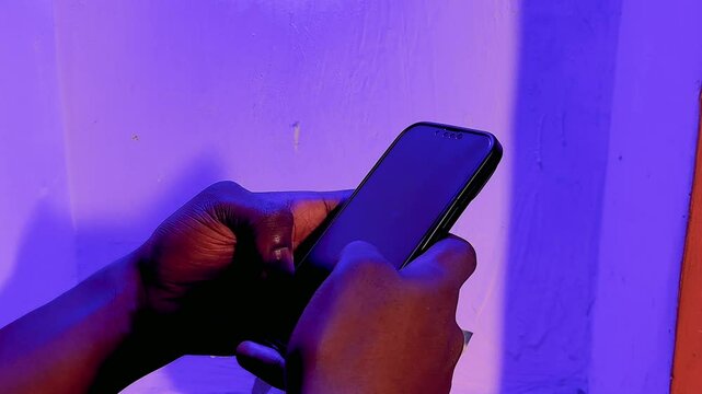 close up of person holding and operating mobile phone