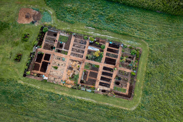 Aerial view of a Community garden located on an island in the Pacific Northwest. Beautiful morning light illuminates a garden area set aside on a land preserve in the Salish Sea area of Washington.