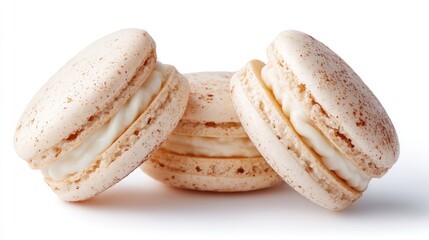 Delicate, light beige macarons with creamy filling