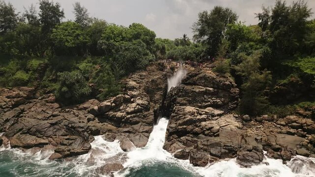 Aerial view Hummanaya Blowhole on southern coast of Sri Lanka, showcasing powerful ocean spray erupting through coastal rock cliffs near Kudawella village. Famous travel destination in Srilanka
