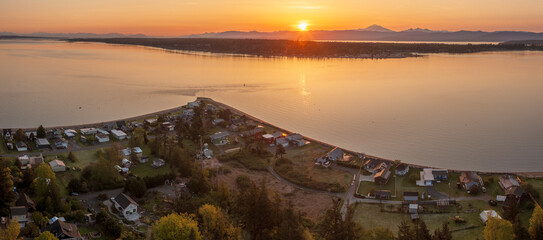 Sunrise aerial view of Lane Spit overlooking Hale Pass on Lummi Island, Washington. Mt. Baker and Gooseberry Point on the Lummi Indian Reservation can be seen in the background. 