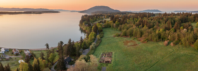 Aerial view of the east side of Lummi Island during a beautiful sunrise over the Curry Preserve.  Located in the Salish Sea with Lummi Mountain in the background and Hale Pass to the east.
