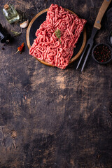 Raw minced meat on dark background