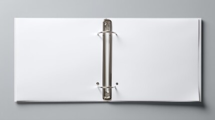 Empty, open, white binder with metal rings