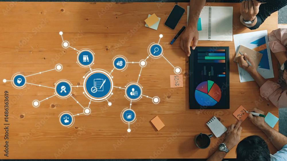 Aufkleber a top-down view of a collaborative workspace showcasing data analysis charts, digital graphics, and 
