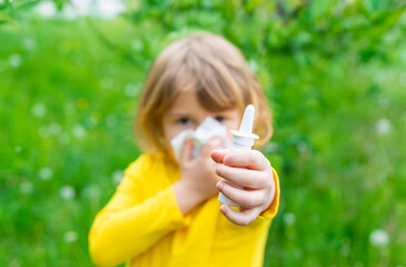 The child is allergic to dandelions. Selective focus.