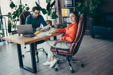 Colleagues Engaged in a Professional Discussion at a Modern Workplace Setting with Stylish Office Interior