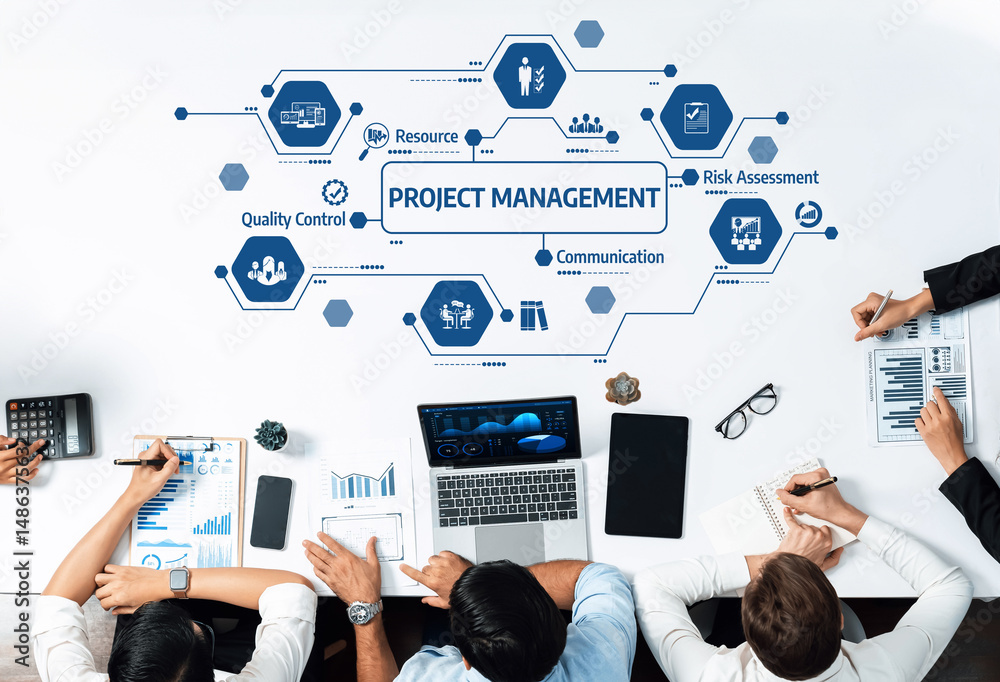 Poster This image showcases a dynamic office space where a diverse team collaborates on project management strategies, emphasizing key concepts and visual aids for effective communication. Amity