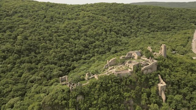 Aerial panoramic view Ujarma Fortress. Ancient Hilltop Royal Citadel and Strategic Stronghold of the Iberian Kings in Kakheti, Georgia. Sightseeing destination in Kakheti wine region
