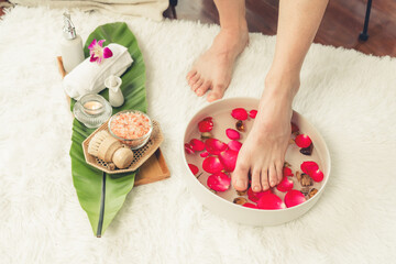 Woman indulges in blissful foot massage at luxurious spa salon while masseur give reflexology...