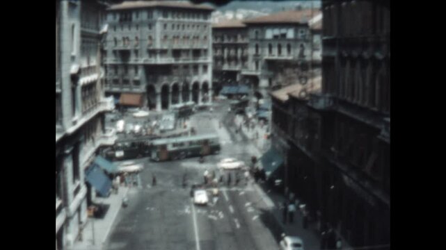 Traffic in Piazza Goldoni 1964 - Seen from Scala dei Giganti, traffic moves through Piazza Goldoni in Trieste, Italy in 1964.