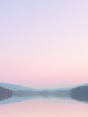 Serene Sunrise Reflection Over a Tranquil Lake Surrounded by Silhouetted Mountains and Soft Pastel Sky in Early Morning Light