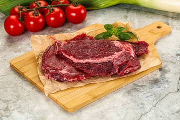 Raw beef cheeks cut for cooking