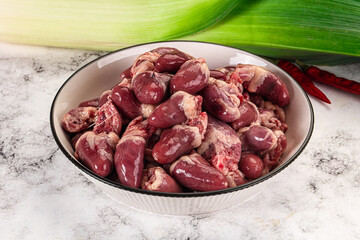 Raw chicken hearts in the bowl