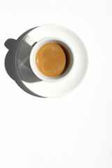 Strong Aromatic Espresso with Crema on White Background. Freshly Made Coffee.
