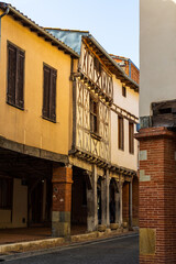 Wooden-covered facades in the village of Lézat-sur-Lèze