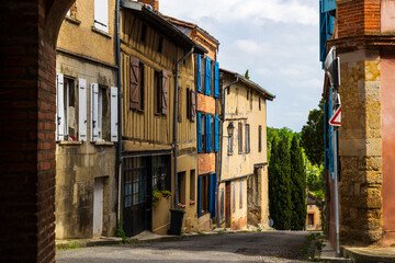 Old brick facade in the village of Saint-Ybars, in the Terrefort region of Ariège