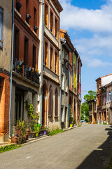 Old brick facade in the village of Saint-Ybars, in the Terrefort region of Ariège