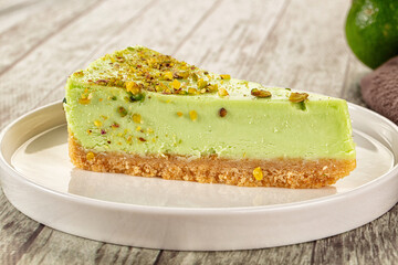 Green pistachio cheesecake served mint