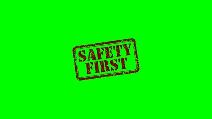 Animated "Safety First" rubber stamp seal with red text on a green screen chroma key background, ideal for workplace safety videos, health guidelines and construction zones warning sign