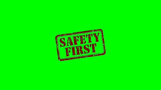 Animated "Safety First" rubber stamp seal with red text on a green screen chroma key background, ideal for workplace safety videos, health guidelines and construction zones warning sign