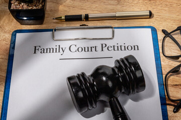 Family Court Petition Document with Gavel on Wooden Desk – Legal Family Dispute Filing
