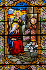 Stained glass (19th century) of Holy family at home: Jesus infant, Virgin Mary and St Joseph the...