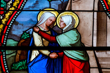 Fototapeta premium Stained glass (19th century) of Visitation of the Virgin Mary to her pregnant cousin Elizabeth.