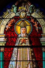 Stained glass (19th century) of Virgin Mary at prayer.