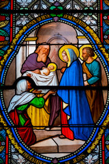 Fototapeta premium Stained glass (19th century) of The childhood of Jesus: Presentation of Jesus at the Temple.